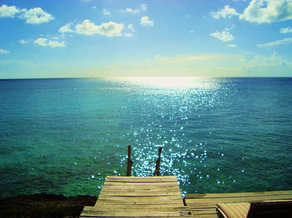 A dock with the ocean in the background