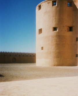 A large tower with windows on the top of it.